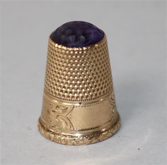 A Polish 583 standard yellow metal and amethyst coloured stone set thimble.